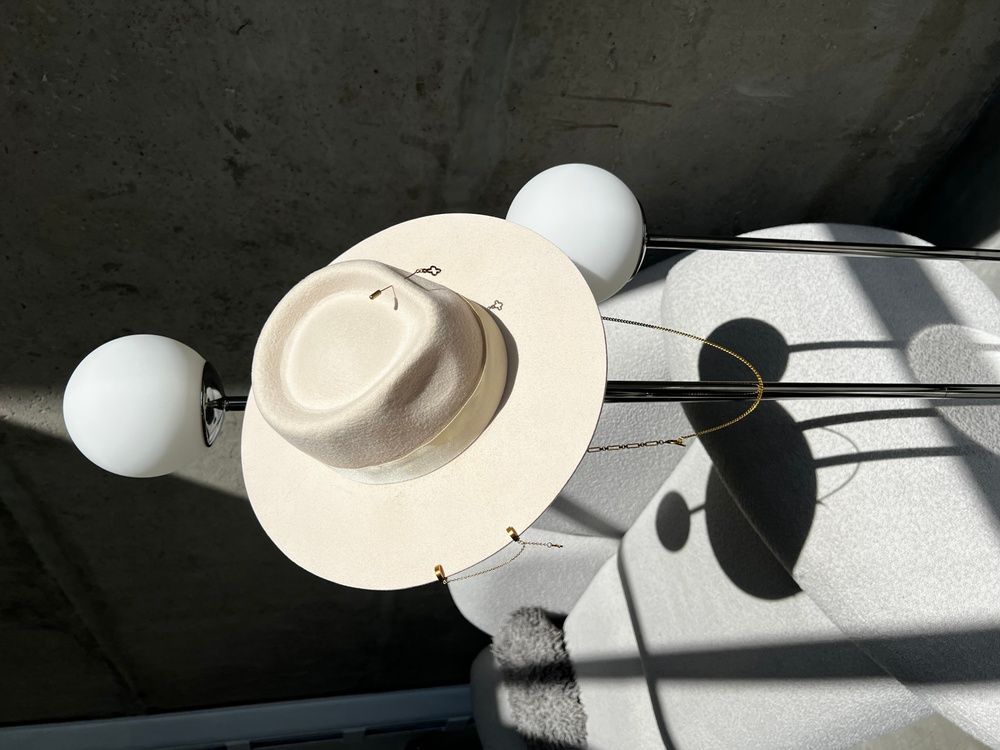 Women's felt fedora hat with decor and chain, beige
